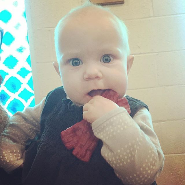 Instagram: Gnawing on bacon teether during Mass. #notadogtoy